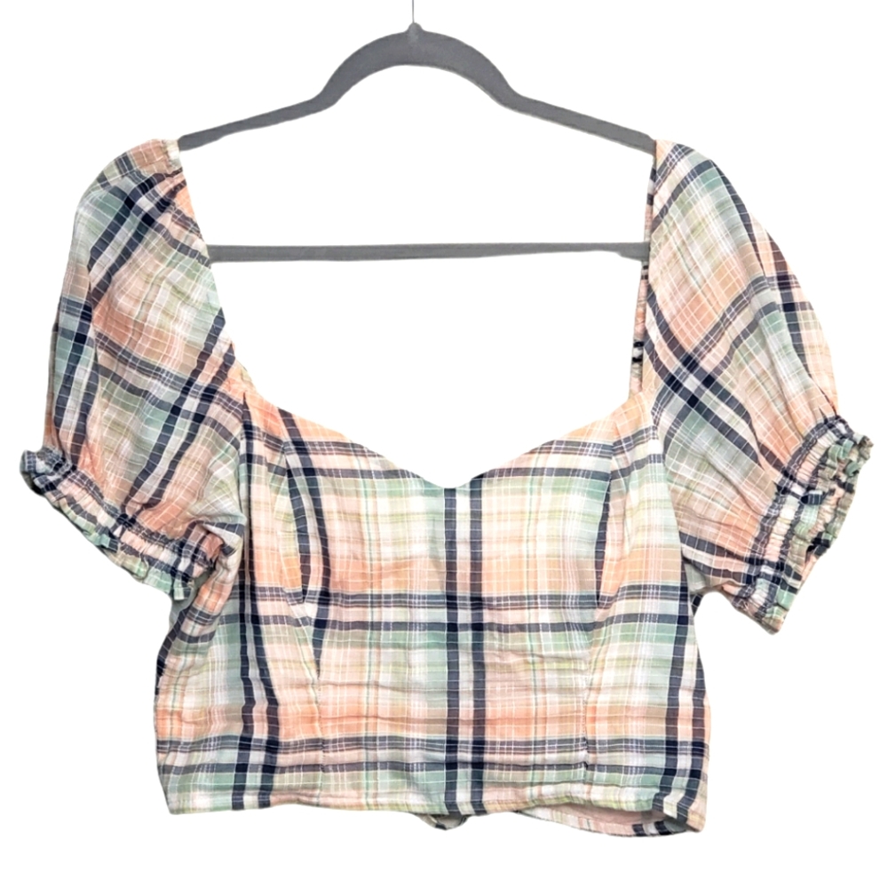 Lace puffy armed crop top with open string design at the back of the shirt.